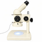 ST100 stereo microscope with corded LED ring light illuminating the stage, side view